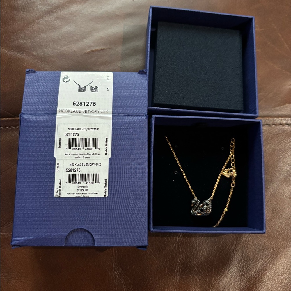 NIB Swarovski Rose Gold Facet Swan Reversible pendant